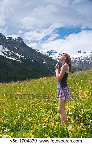 young woman enjoying warm spring in Swiss Alps, Saas Fee, Valais canton, Switzerland View Large Photo Image Stock Photo - young woman enjoying warm spring in Swiss Alps, Saas Fee, Valais canton, Switzerland. Fotosearch
