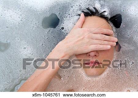 young woman face having a bath View Large Photo Image Stock Image - young woman face having a bath. Fotosearch