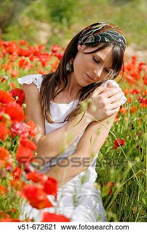 Young woman feeling good in the countryside View Large Photo Image Stock Image - Young woman feeling good in the countryside. Fotosearch