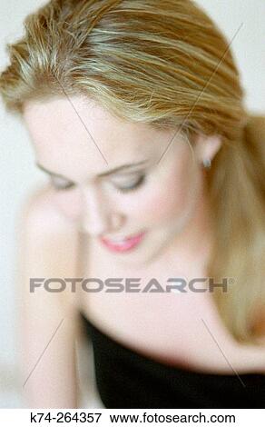 Young Woman Gazing Downward View Large Photo Image Stock Photo - Young Woman Gazing Downward. Fotosearch