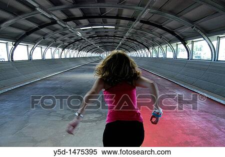 young woman, girl running to the exit, entrance to train station, Geneva, switzerland View Large Photo Image Stock Photography - young woman, girl running to the exit, entrance to train station, Geneva, switzerland. Fotosearch