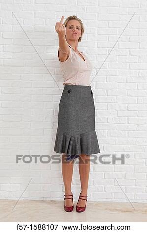 Young woman giving the middle finger View Large Photo Image Stock Photo - Young woman giving the middle finger. Fotosearch