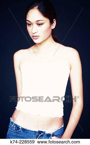 Young woman glancing down View Large Photo Image Stock Photo - Young woman glancing down. Fotosearch