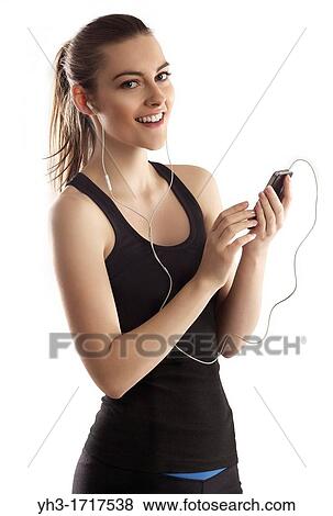 Young woman handholding a smartphone View Large Photo Image Stock Photo - Young woman handholding a smartphone. Fotosearch