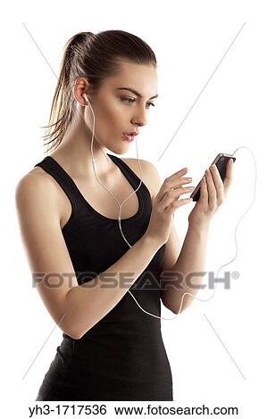 Young woman handholding a smartphone View Large Photo Image Stock Photograph - Young woman handholding a smartphone. Fotosearch