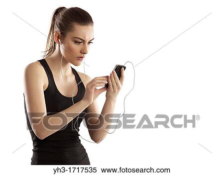 Young woman handholding a smartphone View Large Photo Image Stock Photography - Young woman handholding a smartphone. Fotosearch