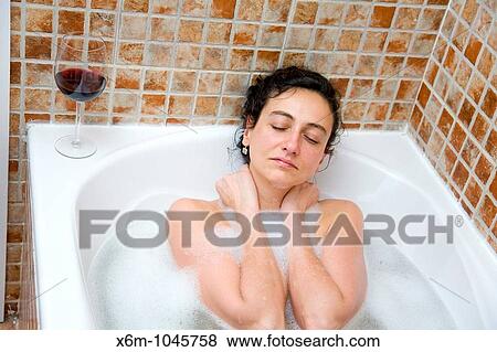 young woman having a bath View Large Photo Image Stock Photo - young woman having a bath. Fotosearch