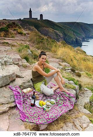 Young woman having a picnic in a cliff Cape Fr? hel, Cancale, Ile-et-Vilaine, Brittany, France, Europe View Large Photo Image Stock Photograph - Young woman having a picnic in a cliff Cape Fr? hel, Cancale, Ile-et-Vilaine, Brittany, France, Europe. Fotosearch