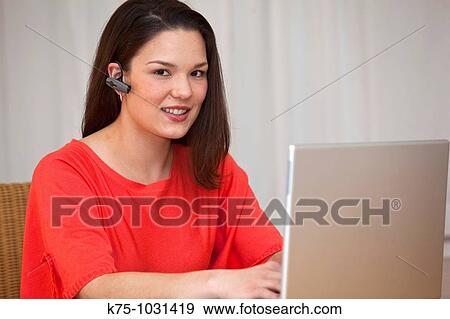 young woman headphone and laptop View Large Photo Image Stock Photo - young woman headphone and laptop. Fotosearch