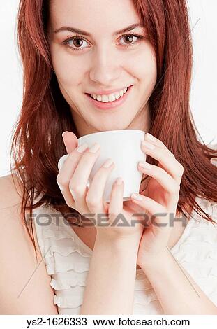 Young woman holding a white cup View Large Photo Image Stock Image - Young woman holding a white cup. Fotosearch