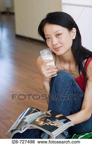 Young Woman Holding glass of Milk View Large Photo Image Stock Photo - Young Woman Holding glass of Milk. Fotosearch