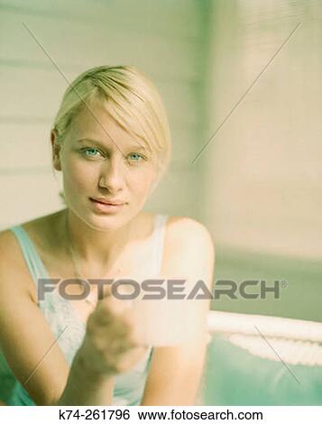 Young woman holding mug View Large Photo Image Stock Photograph - Young woman holding mug. Fotosearch