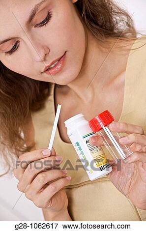 young woman holding self analysis urine test tube for diabetes View Large Photo Image Stock Photo - young woman holding self analysis urine test tube for diabetes. Fotosearch