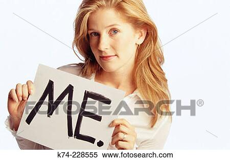 Stock Photography - young woman holding up sign. Fotosearch