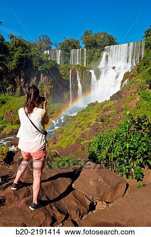 Young woman. Iguaz Falls. Iguaz National Park. Argentina/Brazil View Large Photo Image Picture - Young woman. Iguaz Falls. Iguaz National Park. Argentina/Brazil. Fotosearch