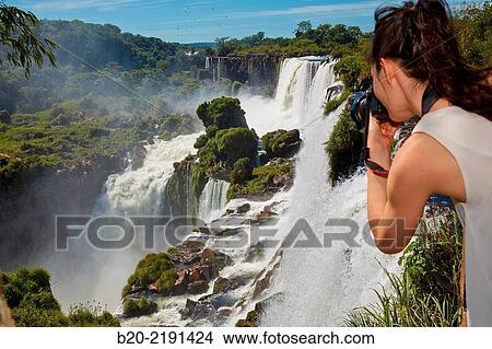 Young woman. Iguaz Falls. Iguaz National Park. Argentina/Brazil View Large Photo Image Picture - Young woman. Iguaz Falls. Iguaz National Park. Argentina/Brazil. Fotosearch