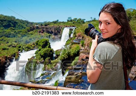 Young woman. Iguaz Falls. Iguaz National Park. Argentina/Brazil View Large Photo Image Stock Image - Young woman. Iguaz Falls. Iguaz National Park. Argentina/Brazil. Fotosearch
