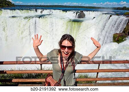 Young woman. Iguaz Falls. Iguaz National Park. Argentina/Brazil View Large Photo Image Stock Image - Young woman. Iguaz Falls. Iguaz National Park. Argentina/Brazil. Fotosearch