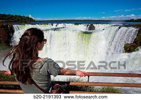 Stock Image - Young woman. Iguaz Falls. Iguaz National Park. Argentina/Brazil. Fotosearch