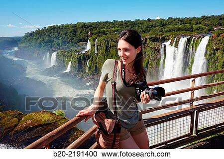 Stock Image - Young woman. Iguaz Falls. Iguaz National Park. Argentina/Brazil. Fotosearch