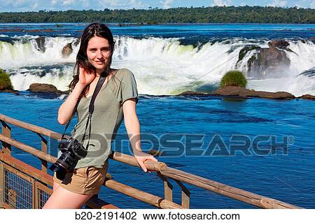 Stock Image - Young woman. Iguaz Falls. Iguaz National Park. Argentina/Brazil. Fotosearch