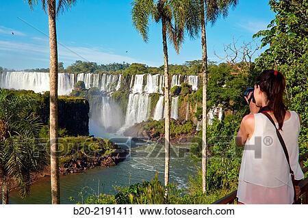 Young woman. Iguaz Falls. Iguaz National Park. Argentina/Brazil View Large Photo Image Stock Image - Young woman. Iguaz Falls. Iguaz National Park. Argentina/Brazil. Fotosearch