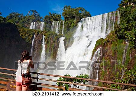 Young woman. Iguaz Falls. Iguaz National Park. Argentina/Brazil View Large Photo Image Stock Image - Young woman. Iguaz Falls. Iguaz National Park. Argentina/Brazil. Fotosearch