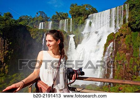 Stock Image - Young woman. Iguaz Falls. Iguaz National Park. Argentina/Brazil. Fotosearch