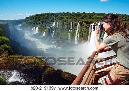 Young woman. Iguaz Falls. Iguaz National Park. Argentina/Brazil View Large Photo Image Stock Photo - Young woman. Iguaz Falls. Iguaz National Park. Argentina/Brazil. Fotosearch