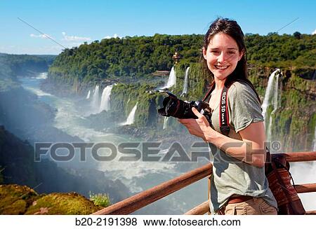 Stock Photo - Young woman. Iguaz Falls. Iguaz National Park. Argentina/Brazil. Fotosearch