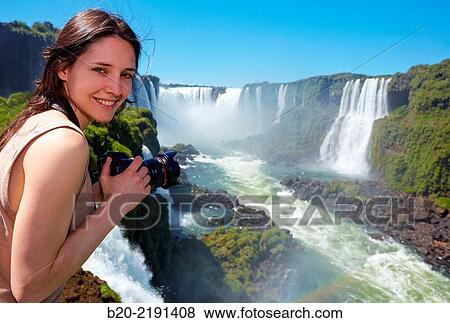Young woman. Iguaz Falls. Iguaz National Park. Argentina/Brazil View Large Photo Image Stock Photo - Young woman. Iguaz Falls. Iguaz National Park. Argentina/Brazil. Fotosearch