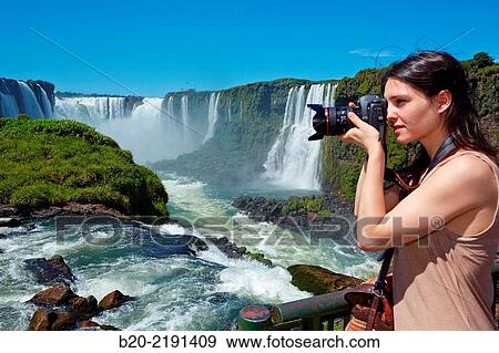 Young woman. Iguaz Falls. Iguaz National Park. Argentina/Brazil View Large Photo Image Stock Photo - Young woman. Iguaz Falls. Iguaz National Park. Argentina/Brazil. Fotosearch