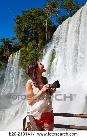 Young woman. Iguaz Falls. Iguaz National Park. Argentina/Brazil View Large Photo Image Stock Photo - Young woman. Iguaz Falls. Iguaz National Park. Argentina/Brazil. Fotosearch