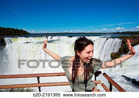 Young woman. Iguaz Falls. Iguaz National Park. Argentina/Brazil View Large Photo Image Stock Photography - Young woman. Iguaz Falls. Iguaz National Park. Argentina/Brazil. Fotosearch
