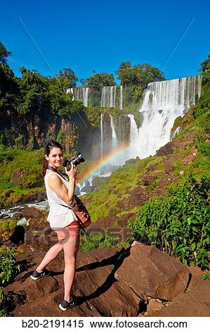 Young woman. Iguaz Falls. Iguaz National Park. Argentina/Brazil View Large Photo Image Stock Photography - Young woman. Iguaz Falls. Iguaz National Park. Argentina/Brazil. Fotosearch