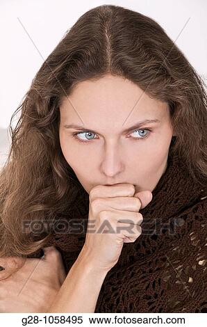 young woman in a brown shawl, coughing with her hand in front of her mouth View Large Photo Image Stock Photography - young woman in a brown shawl, coughing with her hand in front of her mouth. Fotosearch