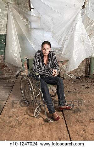 Young woman in a wheelchair View Large Photo Image Picture - Young woman in a wheelchair. Fotosearch