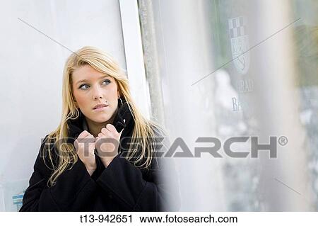 Young woman in Black coat, it's cold View Large Photo Image Stock Image - Young woman in Black coat, it's cold. Fotosearch