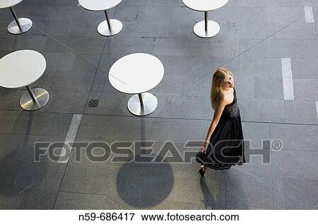 Young woman in black cocktail party dress View Large Photo Image Stock Photo - Young woman in black cocktail party dress. Fotosearch