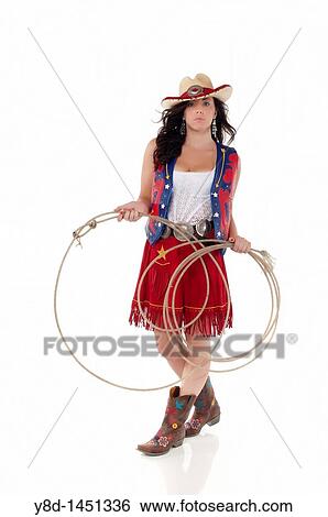 Young woman in cowgirl outfit holding rope View Large Photo Image Stock Photograph - Young woman in cowgirl outfit holding rope. Fotosearch