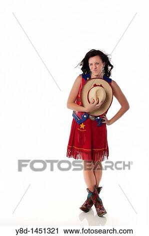 Stock Image - Young woman in cowgirl outfit. Fotosearch