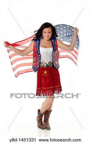 Young woman in cowgirl outfit waving american flag View Large Photo Image Stock Image - Young woman in cowgirl outfit waving american flag. Fotosearch