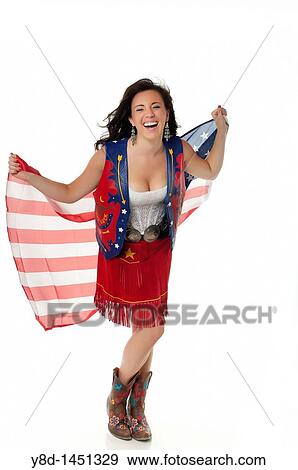 Young woman in cowgirl outfit waving american flag View Large Photo Image Stock Photo - Young woman in cowgirl outfit waving american flag. Fotosearch