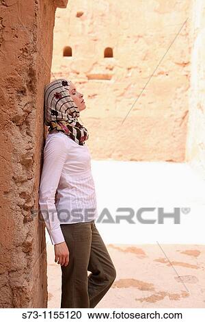 Young woman in El Bad? Palace, wearing a headscarf, Marrakech, Morocco View Large Photo Image Stock Image - Young woman in El Bad? Palace, wearing a headscarf, Marrakech, Morocco. Fotosearch