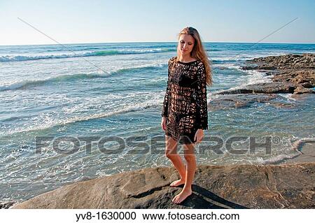 Young woman in fishnet dress View Large Photo Image Stock Image - Young woman in fishnet dress. Fotosearch