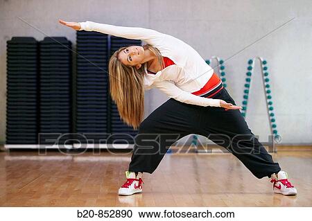 Young woman in gym, dance exercise, aerobics, fitness View Large Photo Image Stock Image - Young woman in gym, dance exercise, aerobics, fitness. Fotosearch