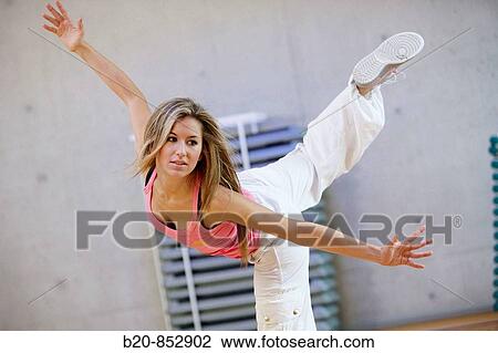 Young woman in gym, dance exercise, aerobics, fitness View Large Photo Image Stock Image - Young woman in gym, dance exercise, aerobics, fitness. Fotosearch