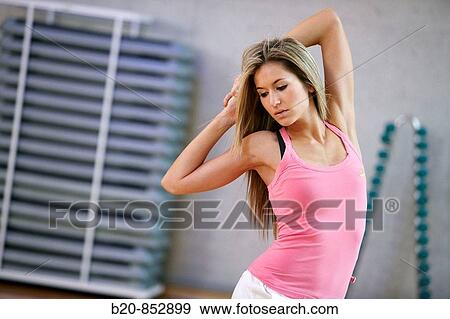 Young woman in gym, dance exercise, aerobics, fitness View Large Photo Image Stock Photo - Young woman in gym, dance exercise, aerobics, fitness. Fotosearch