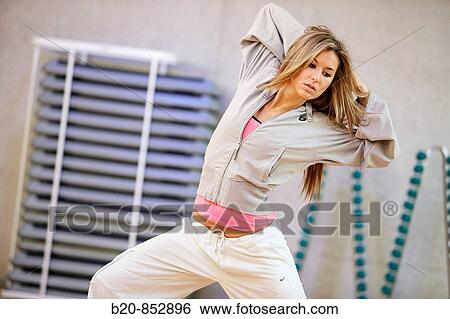 Young woman in gym, dance exercise, aerobics, fitness View Large Photo Image Stock Photograph - Young woman in gym, dance exercise, aerobics, fitness. Fotosearch