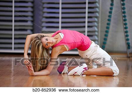 Young woman in gym, dance exercise, aerobics, fitness View Large Photo Image Stock Photograph - Young woman in gym, dance exercise, aerobics, fitness. Fotosearch